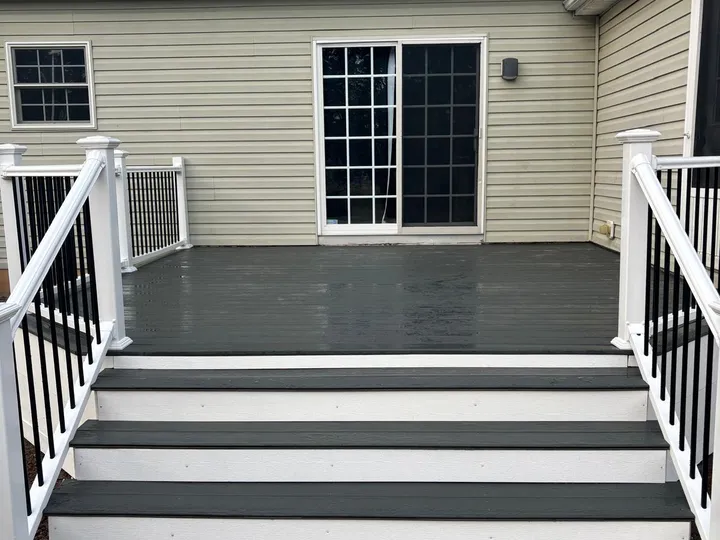Deck entrance with wide stairs and dual railings