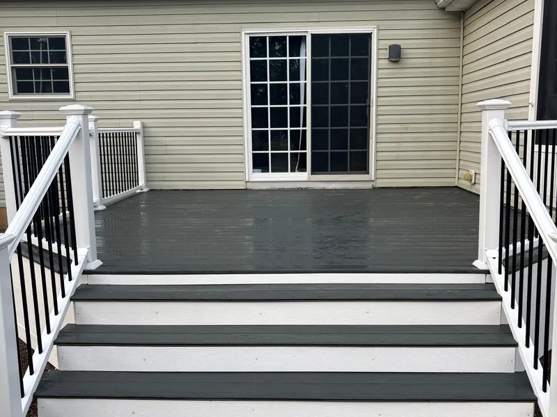 Deck entrance with wide stairs and dual railings